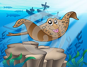 Eagle ray with shipwreck