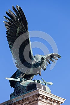 Eagle with a sword in paws