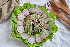 Ealthy spring salad with asparagus on a table