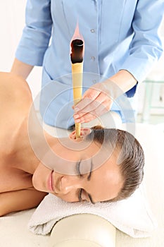 Ear candling, natural purifying treatment