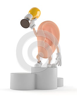 Ear character on podium holding trophy