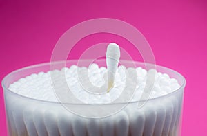Ear cotton swabs on the pink background. Hygienic ears sticks