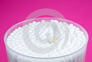 Ear cotton swabs on the pink background. Hygienic ears sticks