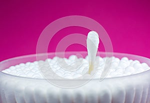 Ear cotton swabs on the pink background. Hygienic ears sticks