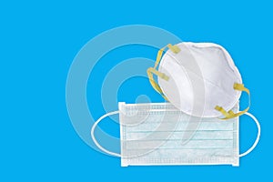 Ear-loop face mask 3 ply, Safety N95 masks on blue background. dust protection respirator and breathing medical respiratory mask