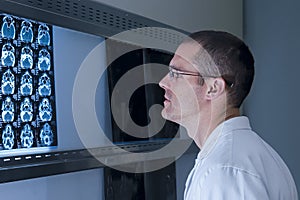 An Ear Nose and Throat Doctor viewing x-rays