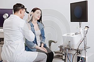 Ear nose throat doctor wearing headlight