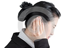 Ear pain symptom in a businesswoman isolated on white background. Clipping path on white background.