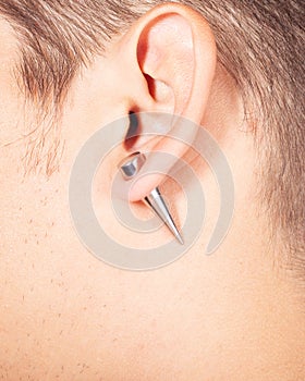 Ear piercing tunnel extension  close up