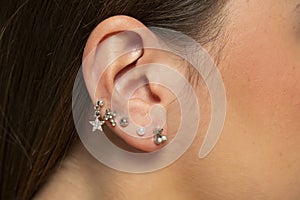 Ear piercings photos.Helix piercing.Ear rings