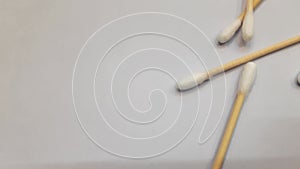 Earbuds are made of thin plastic straw-like materials with cotton Falling down from top