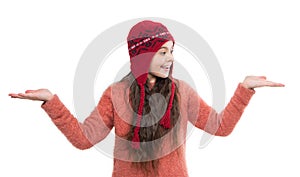 earflap hat knitwear. teen girl presenting product in earflap hat. teen girl in earflap hat