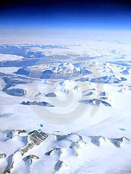 Earial view of a snowy mountains of Greenland