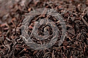 Earl Grey black loose tea leaves background photo