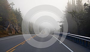 Beautiful early autumn morning fog on Highway 60 in Algonquin Park, Canada