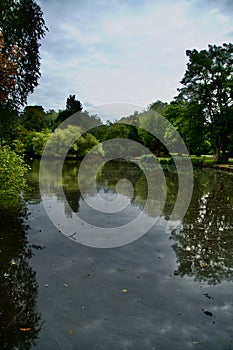 Early Autumn reflections on Queens Park Lake