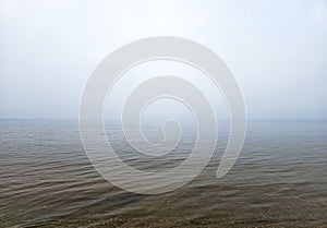 Early foggy morning over the calm Baltic Sea in Jurmala