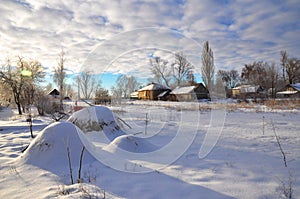 Early frosty morning in small ukrainian village with bokeh effect. Winter scenery