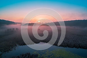 Early misty morning. Sunrise over countryside