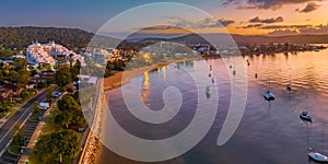 Early morning aerial views over the water with buildings and boats