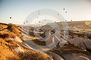 Early morning balloon tourist spectacle in Cappadocia, Turkey