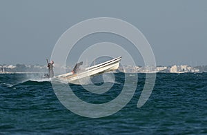 Early morning fishermen moving in sea at Busaiteen coast