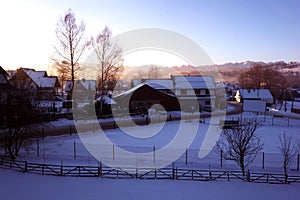 Early morning light over small village in Polish `Spisz` in winter