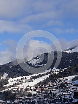 Early morning light reaches chalets