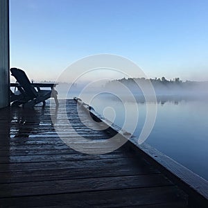 Early morning mist over Lake of the Woods, Kenora, Ontario photo