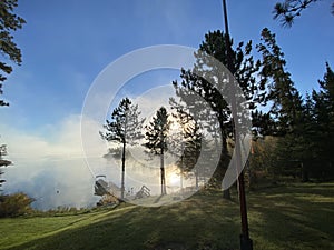 Early Morning mist rising on Lake of the Woods, Ontario