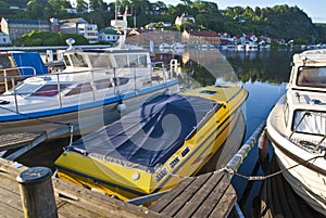 Early morning on quayside in Halden (speedboat) photo
