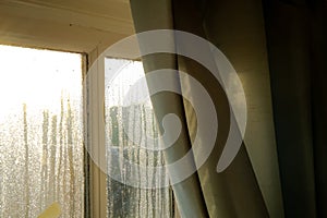 Early morning showing heavy condensation on a bedroom window in early winter.