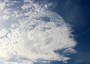 Early morning skies of bright blue and puffy white clouds