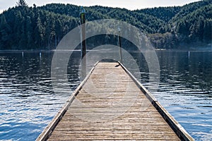 Early morning steam from Tenmile Lake rises around the dock, Lakeview, Oregon, USA