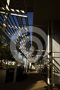 Early morning sun shining through louvres and making shadows. photo
