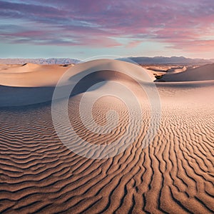 Early Morning Sunlight Over Sand Dunes And Mountains At Mesquite flat dunes, Death Valley National Park, California USA Stovepipe