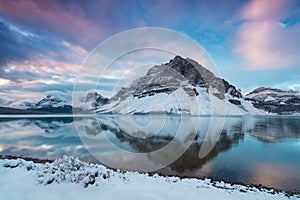 Early morning sunrise at the Bow lake and Crowfoot mountain. Bow Lake is a small lake in western Alberta, Canada. Banff