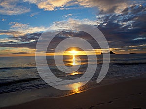 Early Morning Sunrise on Waimanalo Beach over ocean