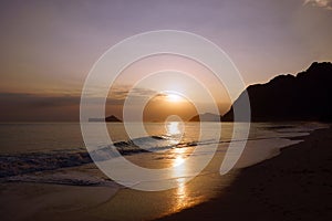 Early Morning Sunrise on Waimanalo Beach over Rock Island over t