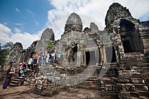 Early morning tourist visiting the Bayon temple, part of Angkor Thom ruin ancient temple Cambodia