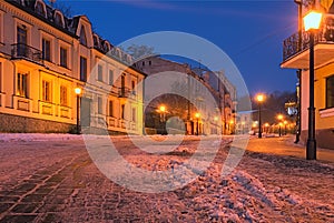 An early morning view of colourful buildings on empty Andriyivskyy Uzvoz Descent or Spusk. One of the oldest street in Kyiv photo