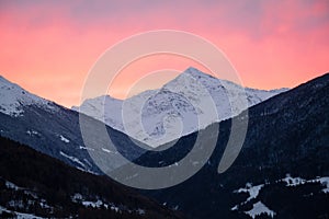 Early morning view of vivid sky and snowy mountains above Santa Caterina from Bormio, Italy