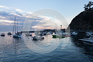 Early morning wide view of sunrise seascape, Avalon Bay, Santa Catalina Island with sailboats, yachts and fishing boats