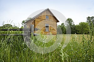 Early settlers' log cabin on the prairie