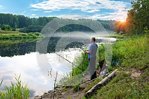 In the early summer morning, a fisherman is fishing in the upper reaches of the Volga River