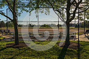 Early sunrise at a baseball field in a municipal park