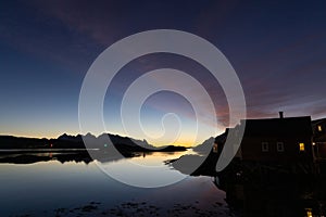 Early sunrise and morning light over Norwegian fisherman\'s hut in Lofoten, Norway