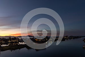 Early sunrise and morning light over SvolvÃ¦r in Lofoten, Norway photo