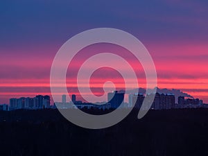 Early sunrise over city park in apartment houses