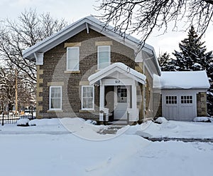 Early 19th century cobblestone home on winter morning